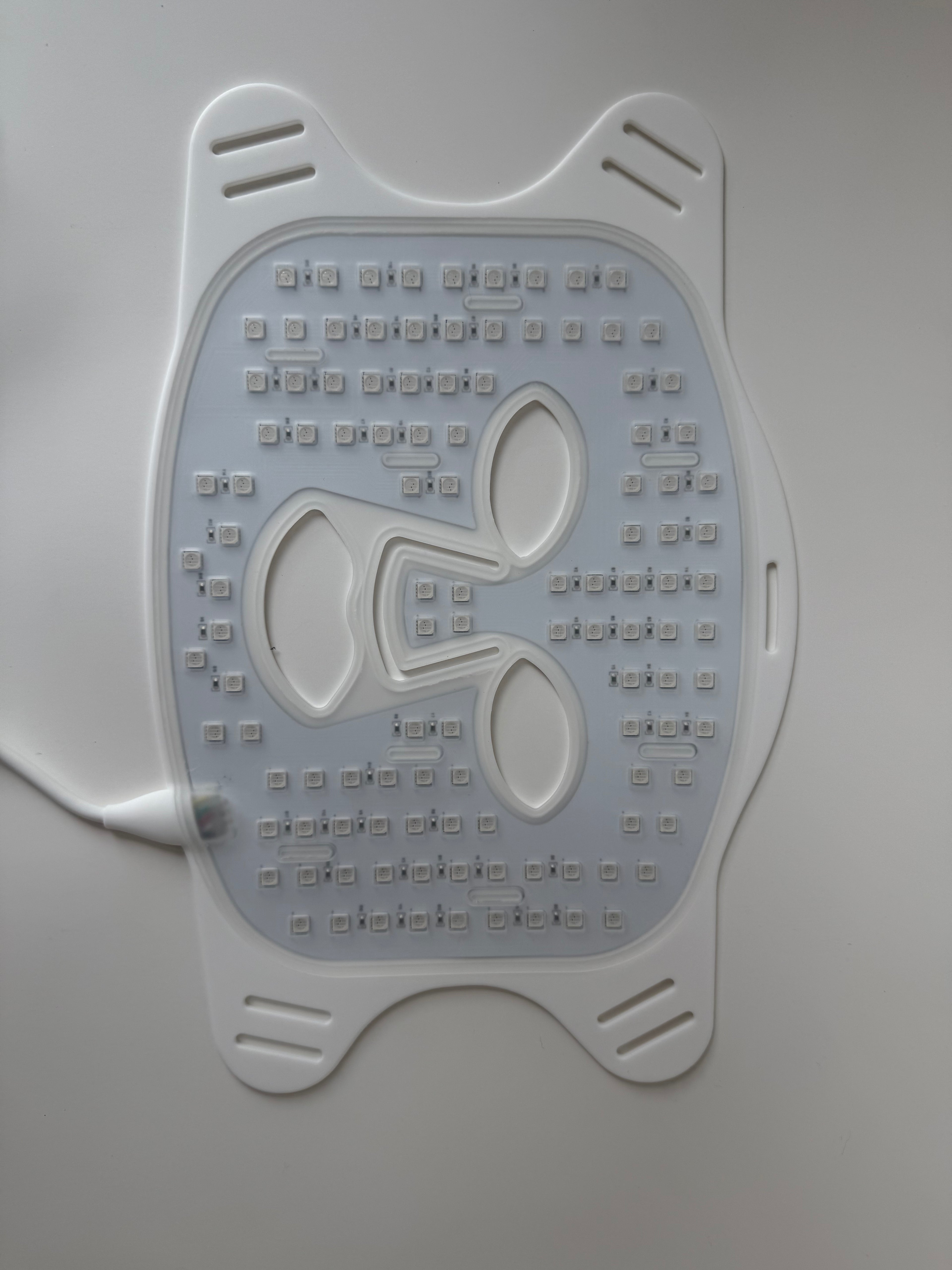 Backside of red light therapy mask showing dense LED light array for skin rejuvenation