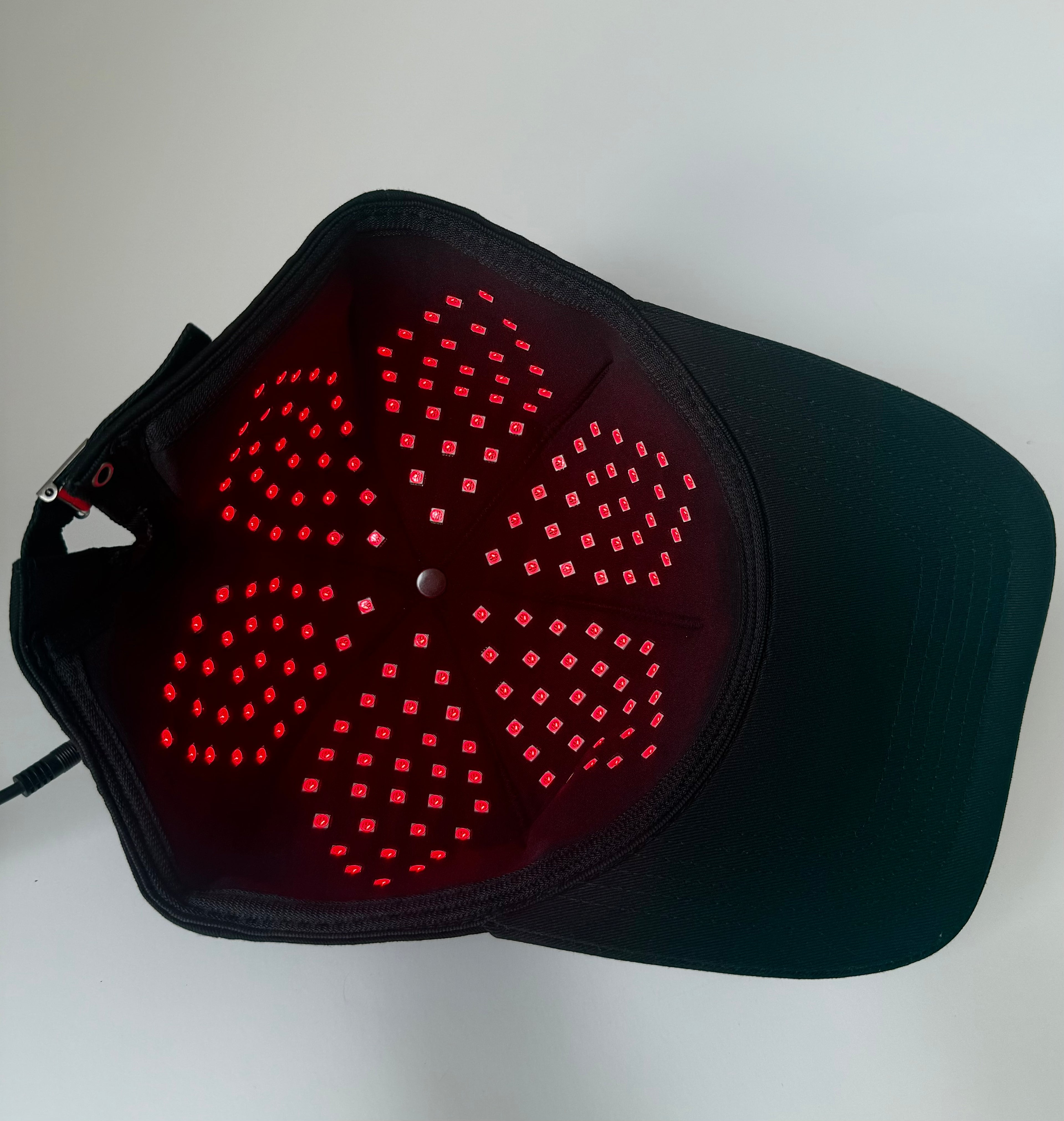 Hair restoration LED cap with timer and pulse settings
