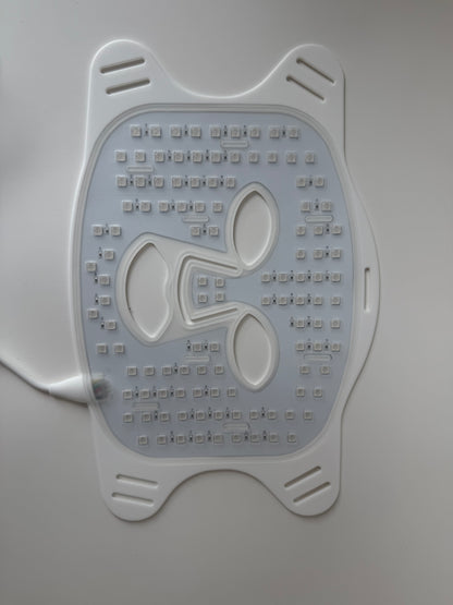 Backside of red light therapy mask showing dense LED light array for skin rejuvenation