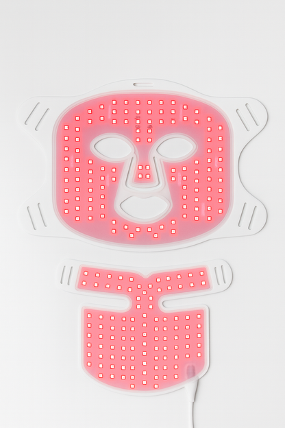 Red LED face mask with a neutral expression on a white background