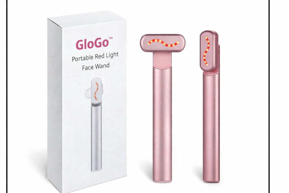 Pink portable red light face wand with packaging on a white background